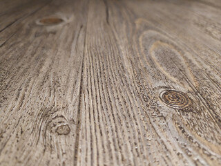 Gray wood texture of a wooden floor in grunge style and vintage style as rustic timber parquet shows cracked surface of hardwood oak woodwork as rough, decorative and dirty interior elegance