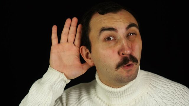 Man with mustache eavesdropping over black background