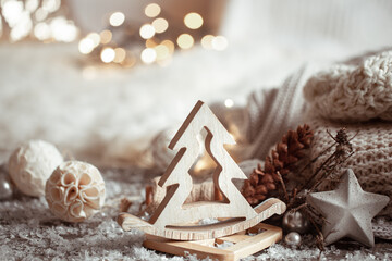 Cozy winter background with wooden decor details and bokeh.