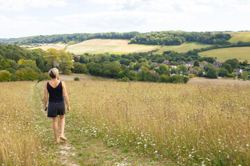 Fototapeta na wymiar woman in field, walking and relaxing