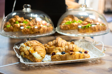 cafeteria tray with homemade scones and croissants. fresh appetizing pastries.