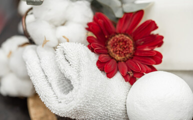 Obraz na płótnie Canvas Spa composition with bath accessories and flower close up.