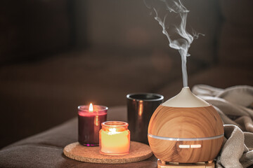 Modern oil aroma diffuser wiht decor details copy space.