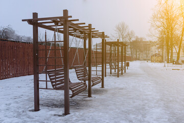 baby swings on chains in the winter