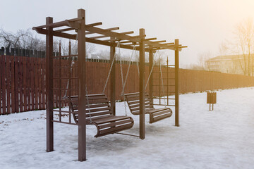 baby swings on chains in the winter