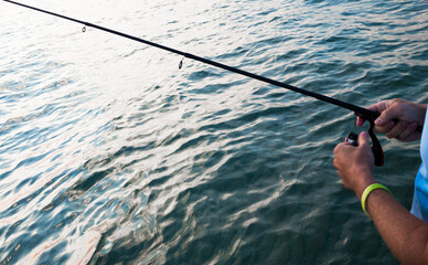 angler with his ultra-light spinning rod