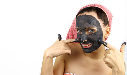 Young beautiful housewife girl with Spa cosmetic mask on her face. Isolated on white background