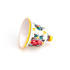 Ceramic bell with traditional floral ornament from Slovakia isolated on white background