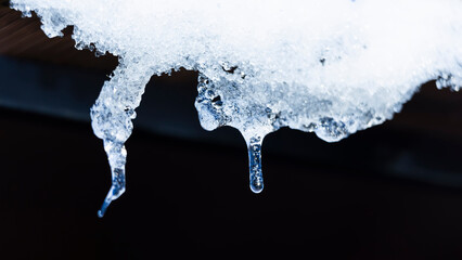 Obraz na płótnie Canvas Hanging crystal shiny transparent icicles