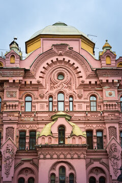 Pink and red historical building Bazin House in Russian style. Decorative facade with turrets, windows, stucco. Saint-Petersburg, Russia