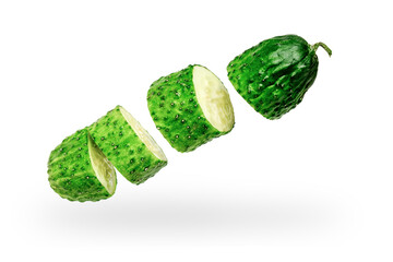 Cucumber cut into pieces on a white background. Isolated. Levitation
