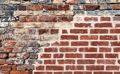 Isolated Brick Wall Red And Black Color. Decay Urban Texture Brick Material. Grungy Rusty Brickwork Surface. Concrete Plaster Cement Mortar.