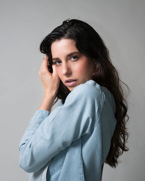 female model posing on white background