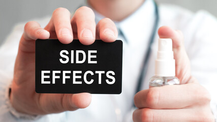 doctor holding a paper card with text SIDE EFFECTS, medical concept