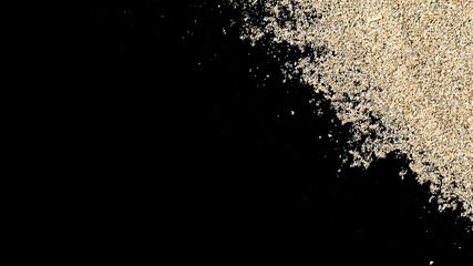 Fototapeta na wymiar Desert pile sand isolated on black. Dust heap beach texture on shore background. Travel concept in minimal style.