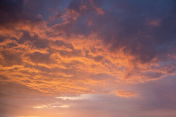 Naklejka na ściany i meble Beautiful golden clouds, sunset sky