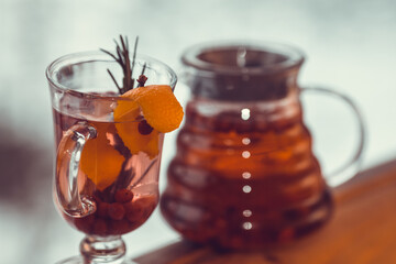 Hot tea in a glass pot and cup