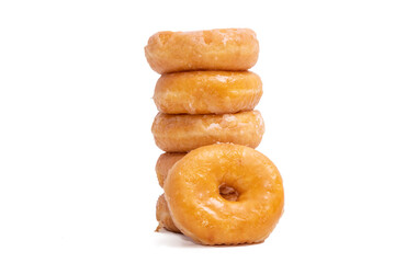 donuts with icing sugar stacked on white background