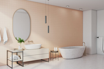 Freestanding bath with mirror in comfortable bathroom.