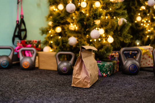 Delivery Package For Sports Near The Christmas Tree