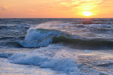 Obraz premium Stormy sea at sunset, Baltic, pink, orange, soft pastel colors
