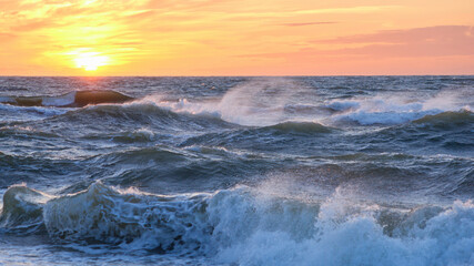 Stormy sea at sunset, Baltic, pink, orange, soft pastel colors


