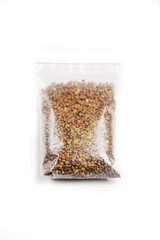 Spinach seeds in germination bag on a white background