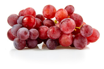 Bunch of red grapes isolated on white background. Still-life picture taken in studio with soft-box.