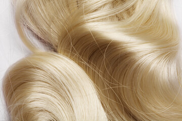 human hair detail. long blond hair as background. texture
