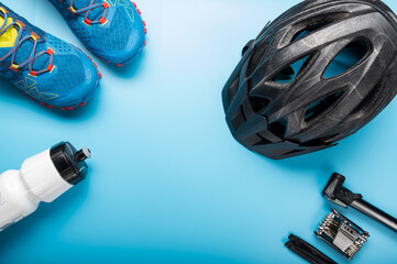 Sports shoes and a bicycle helmet. Bicycle accessories and sneakers.