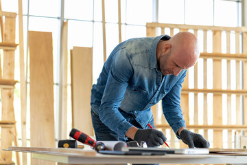 Caucasian carpenter preparing wooden furniture for customers showing handicraft carpentry concept