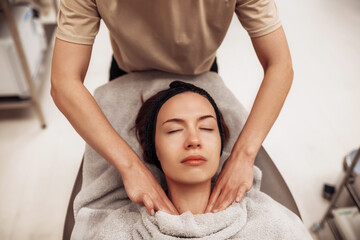 The woman is massaged face and body.