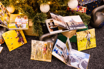 photobook, album and weights for sports near the Christmas tree as a gift holiday