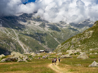 Fototapeta na wymiar Trekking scene in the Italian alps