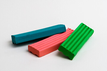 Three multi-colored bars of children's plasticine