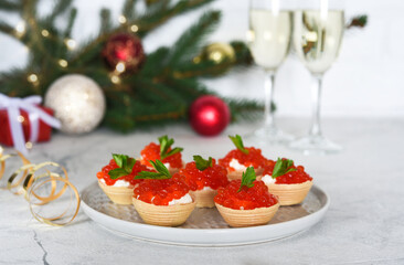Tartlets with red caviar on the New Year's table.