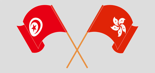 Crossed and waving flags of Tunisia and Hong Kong