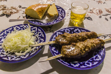 Meal in Uzbekistan - minced meat shashlik.
