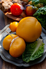 Cheese collection, Italian cheeses provolone, caciocavallo, scamorza made from sheep or cow milk in South Italy, white and yellow smoked.