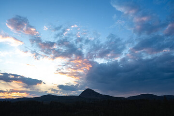 Sunset behind the mountains in national park Krkonose, Czech Republic