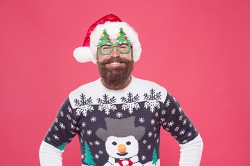 Christmas time. winter knitted sweater. hipster on new year party. holiday fun time. lets celebrate. buy presents and gifts. christmas shop. happy santa claus man in hat and glasses. mature xmas guy