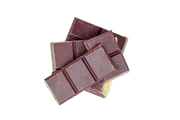 Top view of sweet dark chocolate pieces isolated on white background.