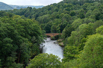 Fototapeta na wymiar Sandstone bridge, Pont Cysyllte also known as Cysylltau Bridge or Bont Bridge across river Dee. Built in 1697 in the Vale of Llangollen in northeast Wales. Great Britain.
