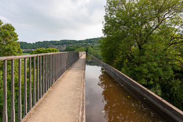 Fototapeta premium Pontcysyllte Aqueduct, carries the Llangollen Canal waters across the River Dee in the Vale of Llangollen in Wales. 18-arched stone and cast iron structure is for use by narrow, canal-boats. UK