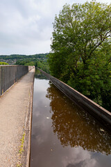 Pontcysyllte Aqueduct, carries the Llangollen Canal waters across the River Dee in the Vale of Llangollen in Wales. 18-arched stone and cast iron structure is for use by narrow, canal-boats. UK