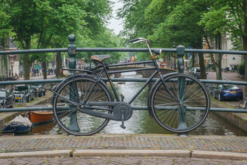 Amsterdam, bike parking over the canal in the middle of bridge