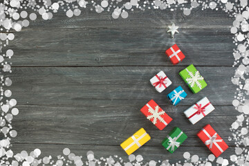 Gift boxes and colorful present for christmas on wood table. Top view with copy space.