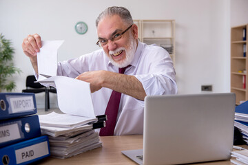 Aged male employee unhappy with excessive work