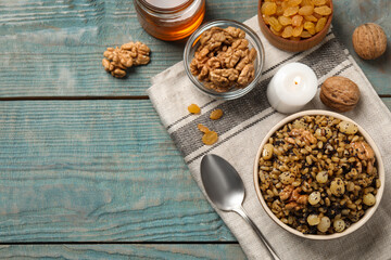 Traditional Christmas slavic dish kutia served on light blue wooden table, flat lay. Space for text