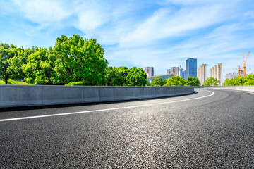 Fototapeta premium Empty asphalt road and Shanghai skyline with buildings scenery.